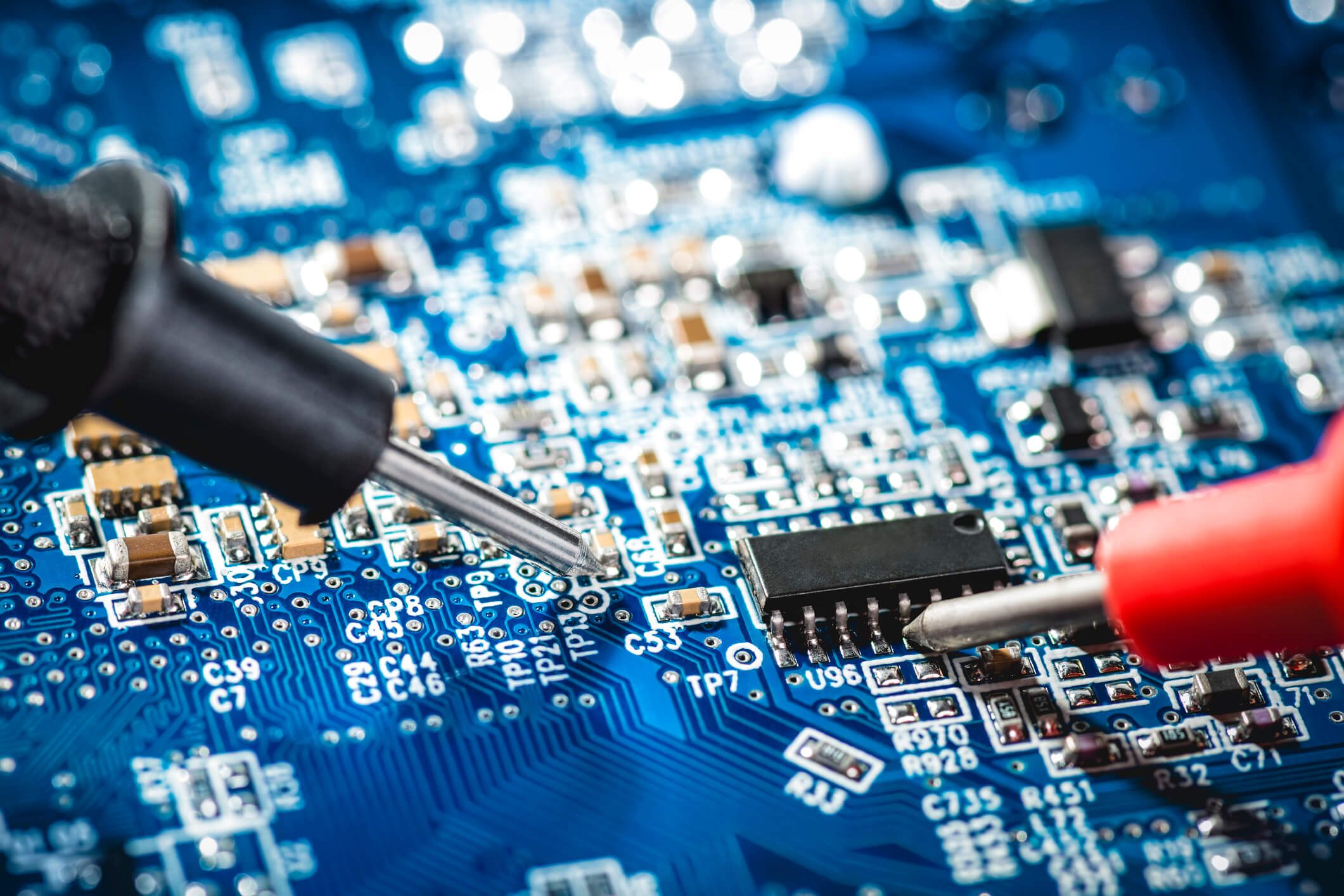 Electronic technician checks the voltage